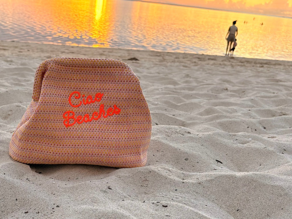 Neon orange Ciao Beaches clutch pouch by Lilly Loves with zipper closure and compact design, perfect for carrying small essentials.