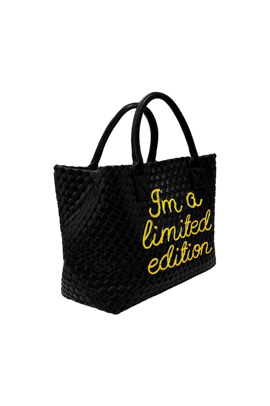 Yellow limited edition Lilly Loves handbag with top handle and gold accents, stylish accessory for fashion-forward looks.