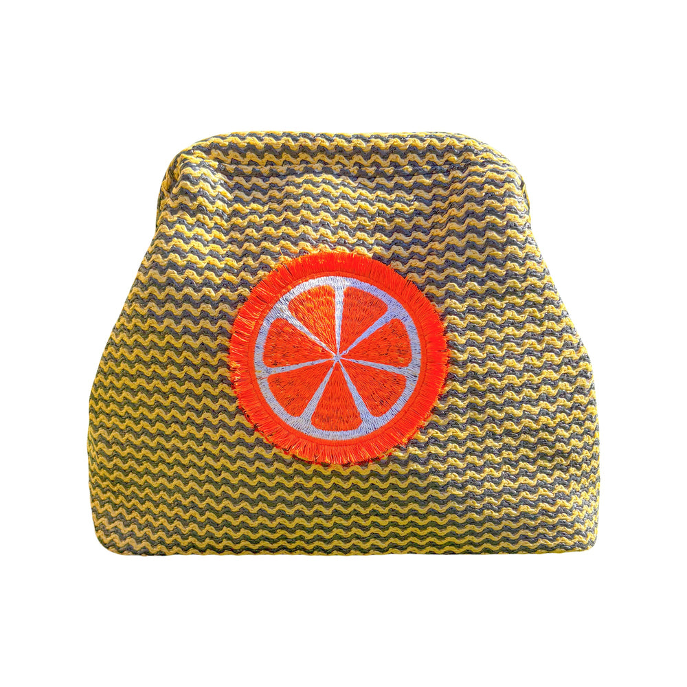 Orange fluffy clutch pouch by Lilly Loves, featuring soft plush material and compact design for stylish carrying.