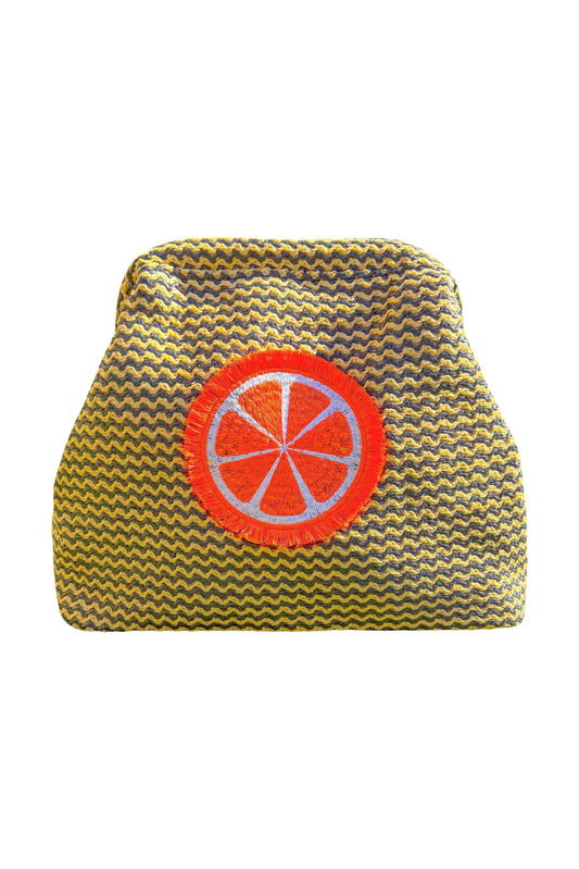 Orange fluffy clutch pouch by Lilly Loves, featuring soft plush material and compact design for stylish carrying.