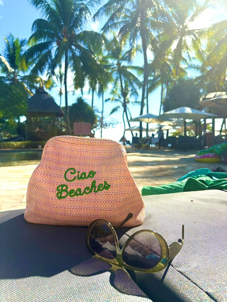 Lilly Loves Ciao Beaches pink clutch pouch with easy closure, stylish and compact accessory for essentials.