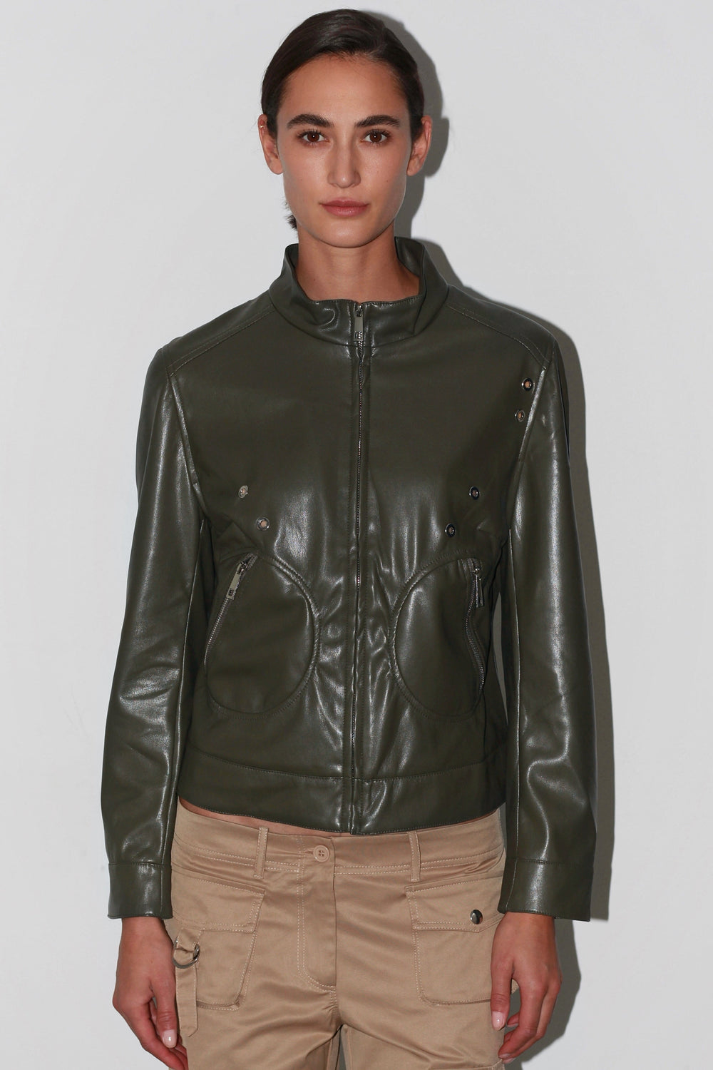 Front view of the Sofi Jacket – dark green leather jacket with structured shoulders and button closure.