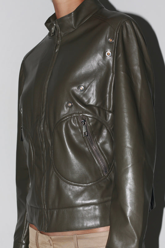 Side close-up – dark green leather jacket showcasing detailed stitching and glossy finish.
