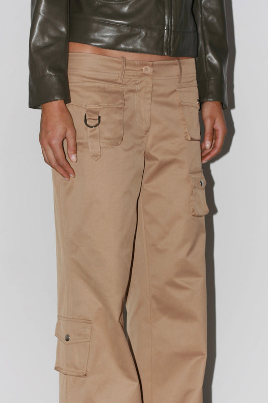 Front view of the Marina Beige Pants – minimalist design with two back pockets and smooth finish.