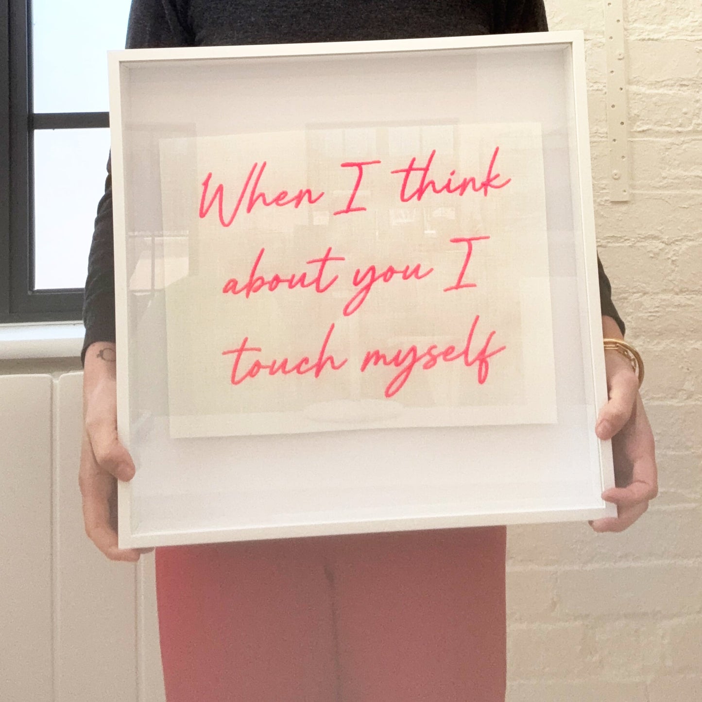 Lillyloves artwork titled "When I Think About You I Touch Myself" held in a close-up frame showing vibrant, expressive colors.