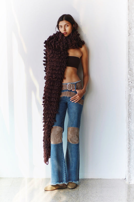 Three-quarter front view – woman wearing the Kika Pants with a brown halter top, confident and stylish look.