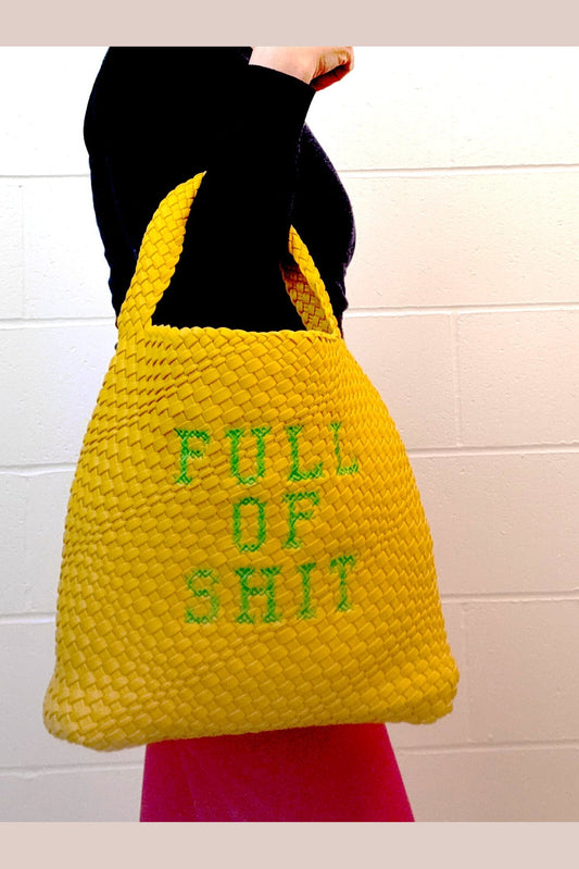 Yellow woven bucket handbag by Lilly Loves with a rounded shape and shoulder strap, featuring a vibrant, textured design.